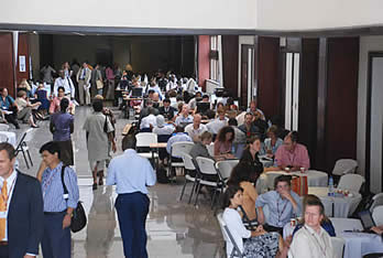 Participants in the Accra International Conference Center discussing between sessions