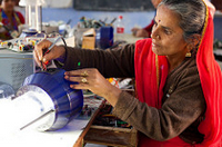 Woman from India repairs solar powered lamp