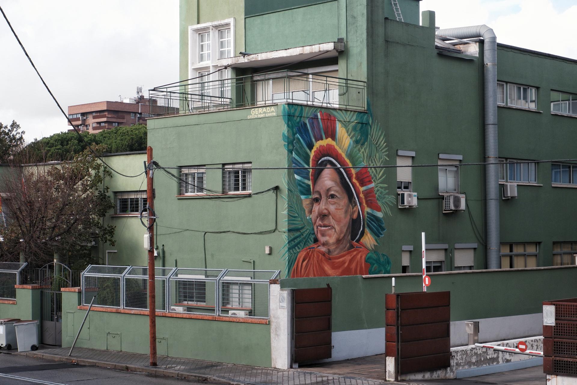 Urban mural portrait of Hilda Pérez in Madrid, a leader of the Indigenous Ashaninka Community