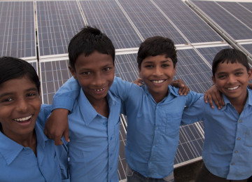 School boys posing before CDM solar Project 6328 - Sustainable development - flexible mechanisms