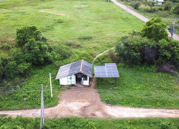 Small house in a rural setting with solar panels