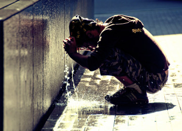 A Londoner suffers in the extreme heat