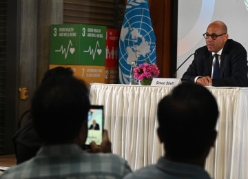 Simon Stiell speaks at a press conference in India