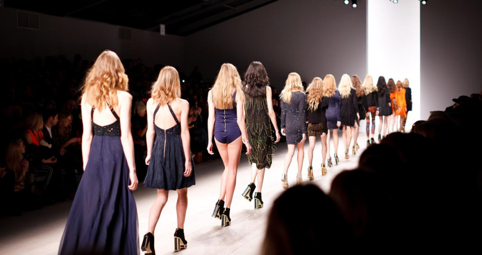 Image of a catwalk with models walking away