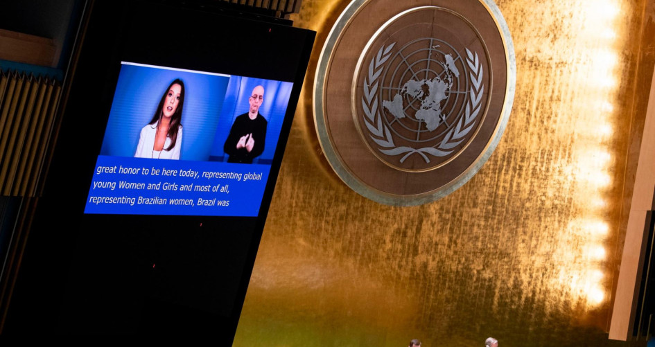Picture of a screen at the United Nations General Assembly featuring Renata Koch Alvarenga