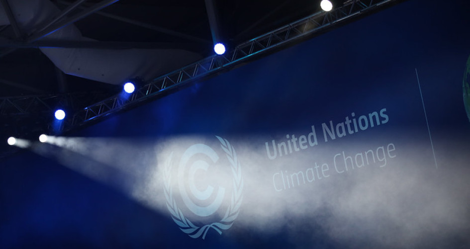 Spotlight being shone on text that reads United Nations Climate Change 