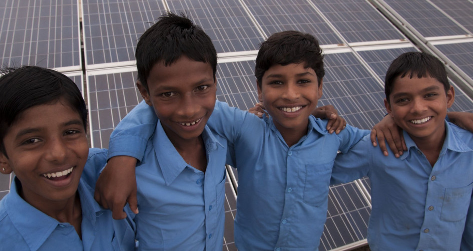 School boys posing before CDM solar Project 6328 - Sustainable development - flexible mechanisms