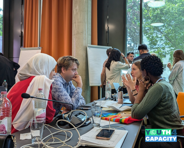 Participants engaged in a breakout group activity