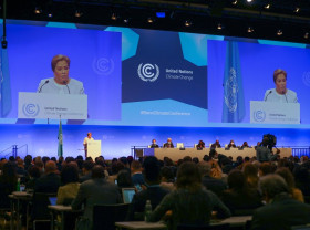 The Bonn Climate Change Conference gets underway in a large meeting room.