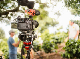 Camera filming an interview.