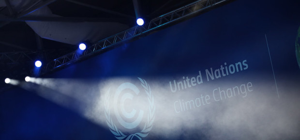 Spotlight being shone on text that reads United Nations Climate Change 