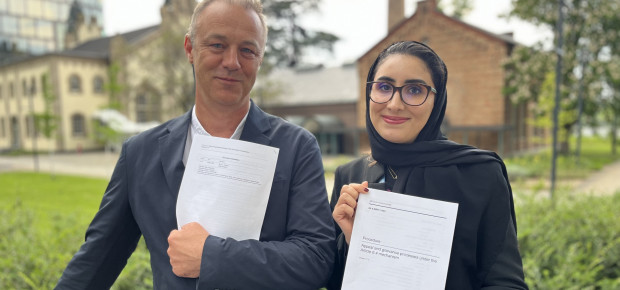 Maria AlJishi (right), Chair of the Article 6.4 Supervisory Body, and Martin Hession, Vice Chair, hold the text that was agreed, which introduces the Appeals and Grievances Procedure.